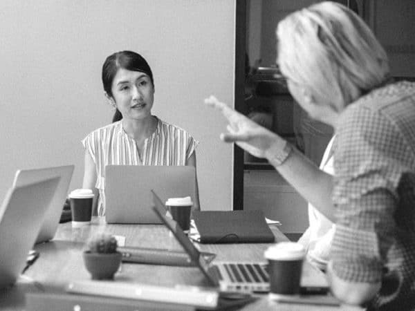 Woman at computer in meeting
