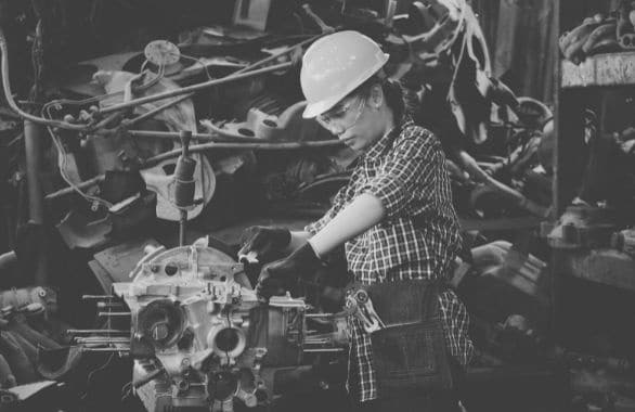 Diesel mechanic using machinery in a factory
